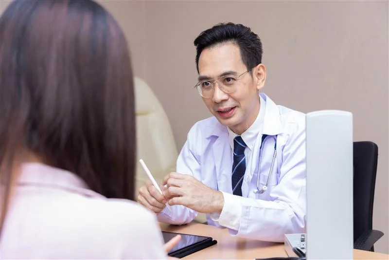 doctor-patient-discussing-while-sitting-table-medicine-health-care-concept